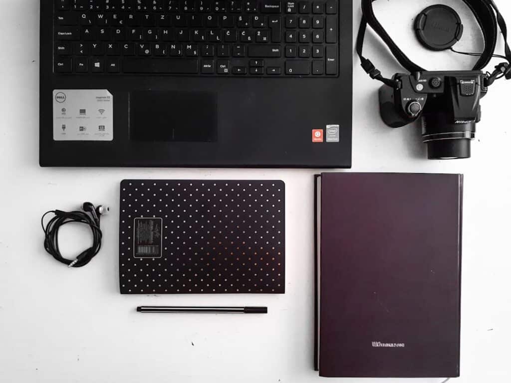 A laptop on a desk in a small business setting.