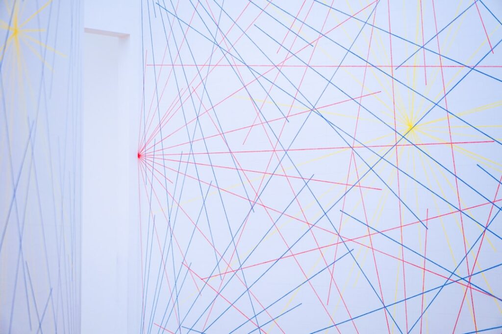 Person stands in front of a large, glowing abstract digital network, symbolizing the complexity of navigating future marke...