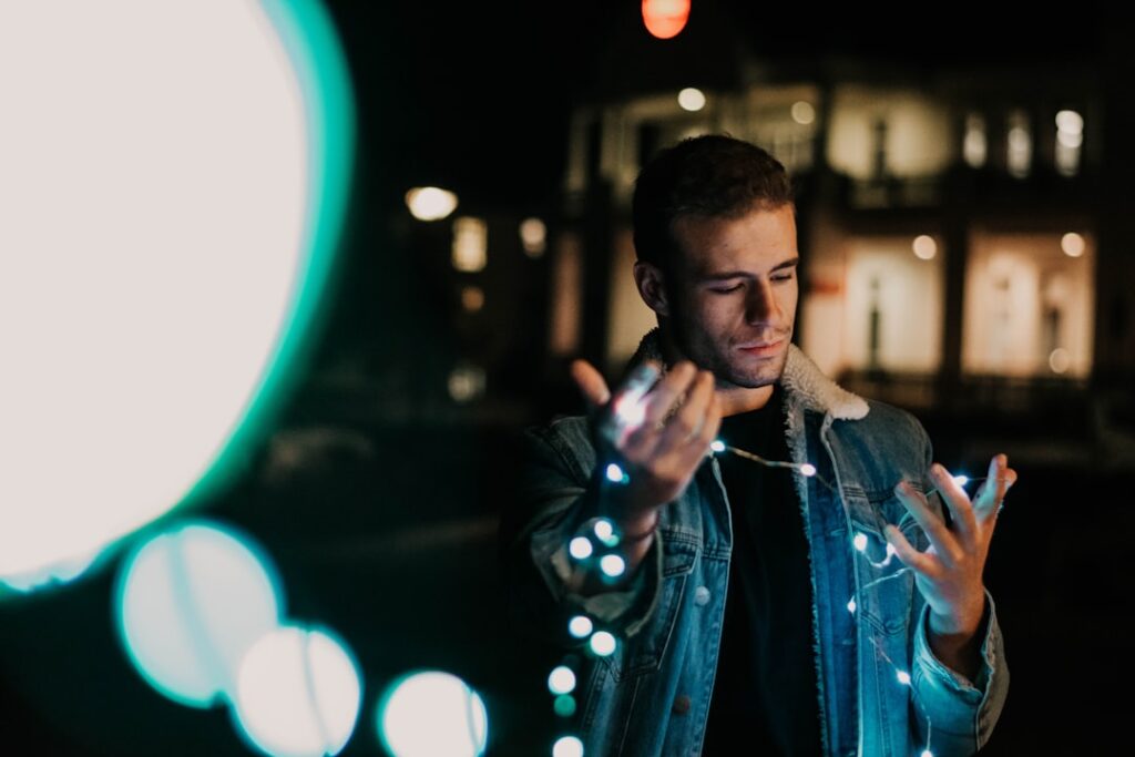 Person's hand interacting with a glowing, futuristic data visualization on a screen, representing the future of AI in search.
