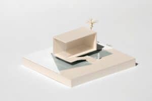 Clean, minimalist architectural model of a building on a white background, representing the foundational structure provide...