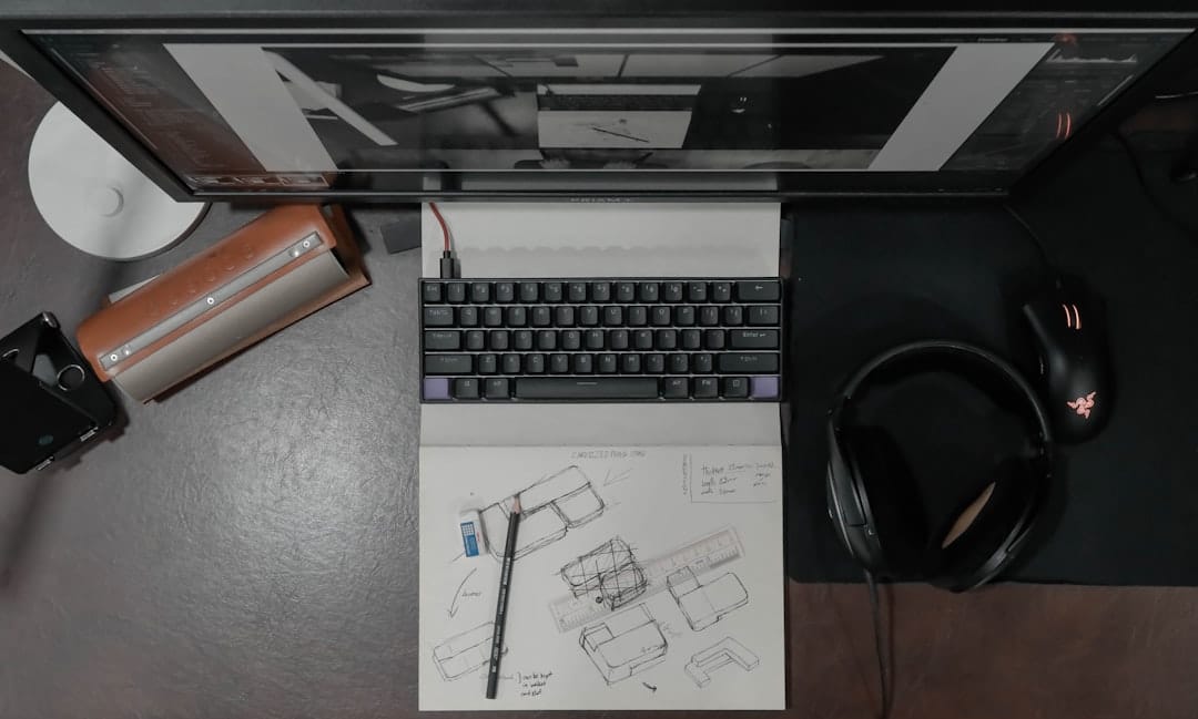A top-down view of an architect's modern desk with rolled-out blueprints, a laptop, and drafting tools, symbolizing a strategic plan for building a future-proof business.